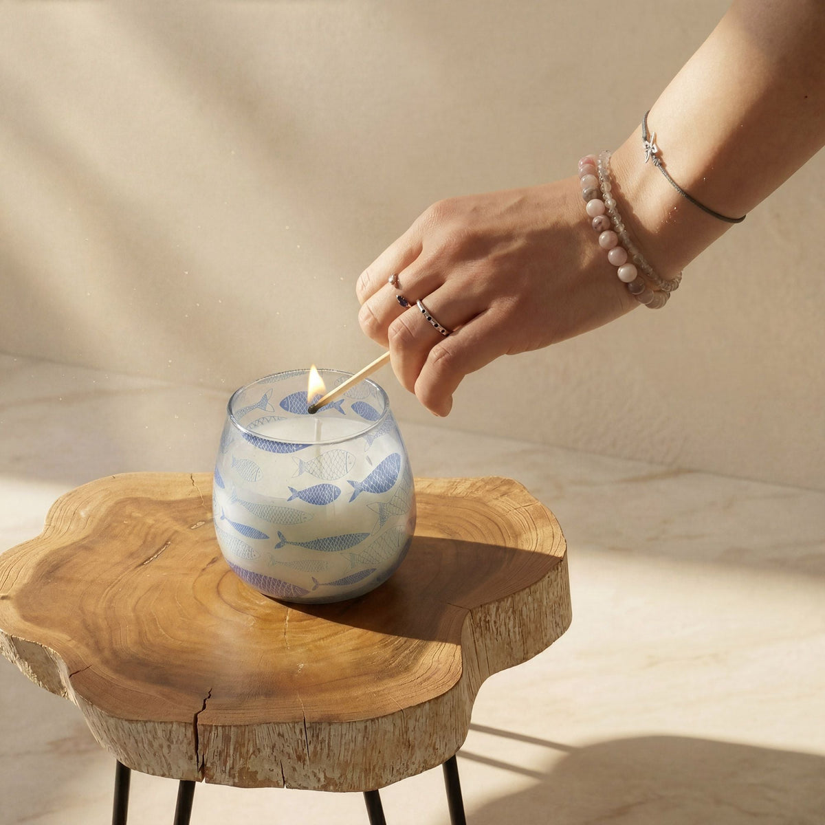 Decorative glass jar candles with botanical and coastal designs