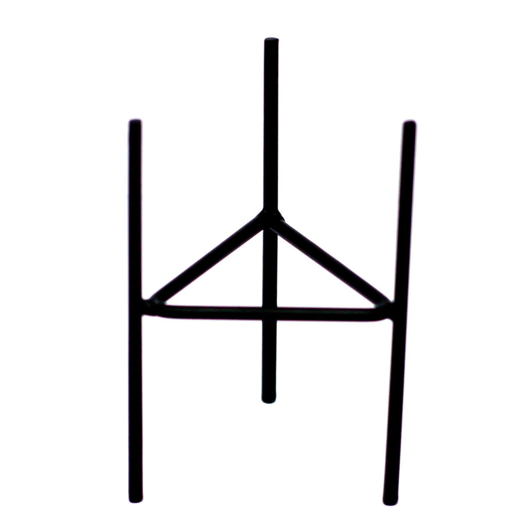 Black iron candle holder stand with three vertical legs and triangular base
